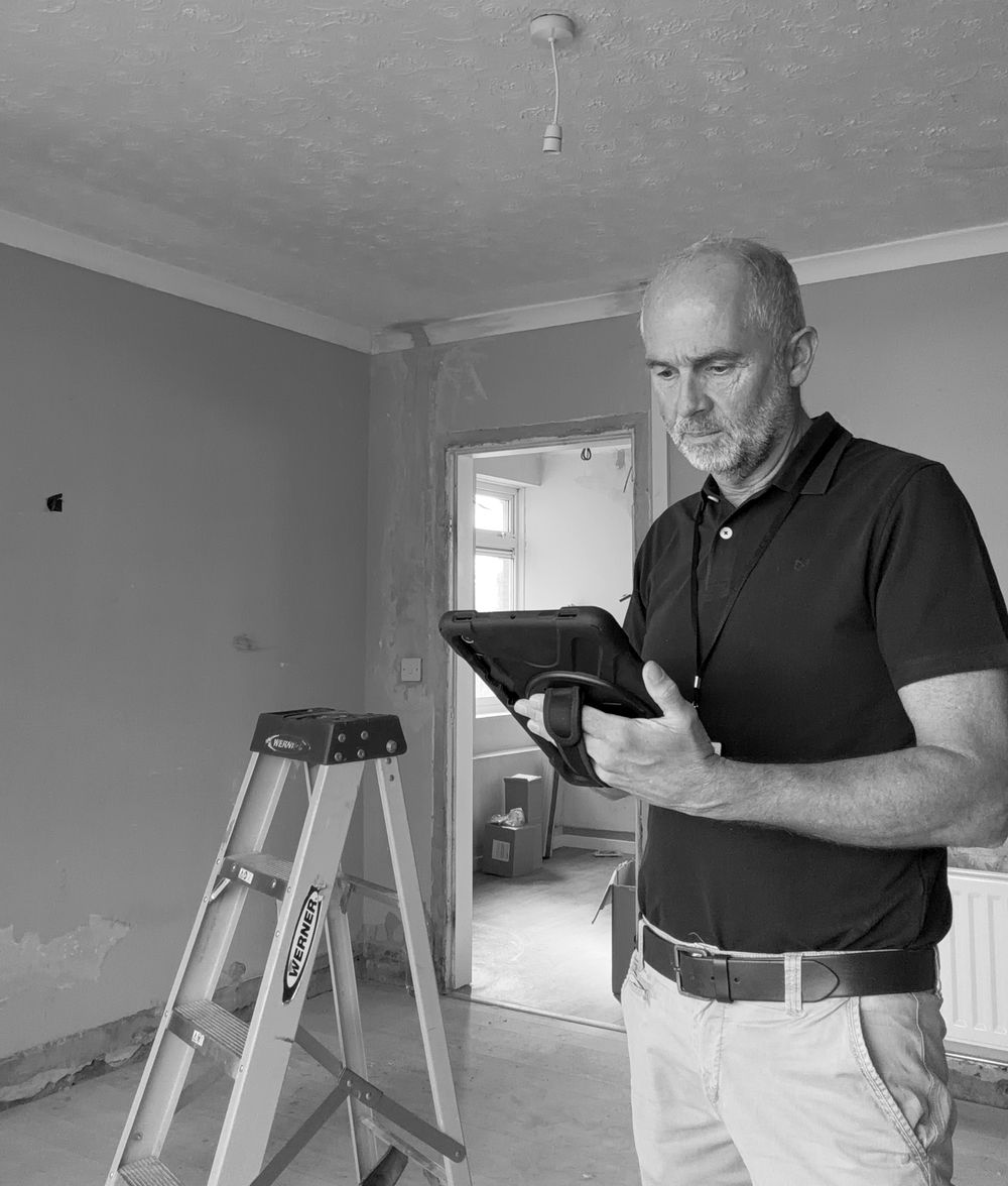 Jim Thomas carrying out an energy assessment on site in Shropshire